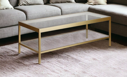 45" Clear Glass And Gold Steel Coffee Table With Shelf